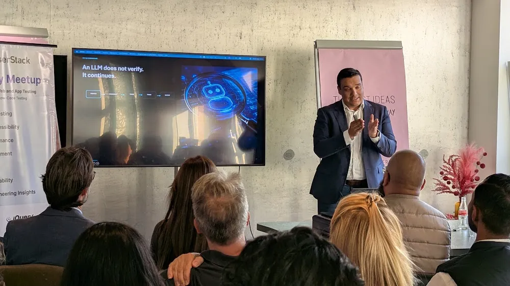 BrowserStack Meetup Amsterdam 2026 — The two talks: Eleonora Belova on Claude + Playwright, and Robert Jadoenandansing on Generative AI in QA (photo 12)