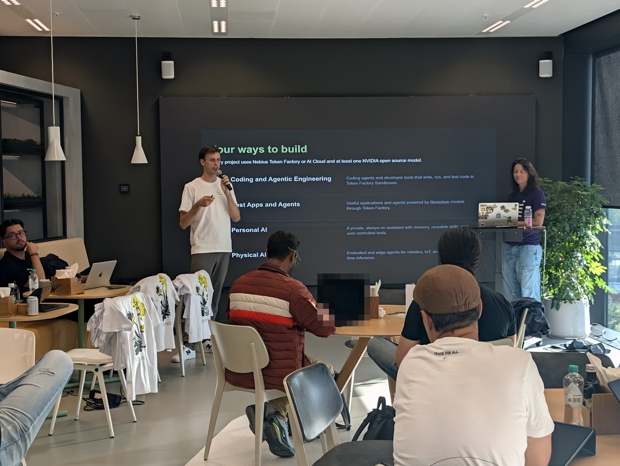 Host presenting the Four ways to build slide listing Coding and Agentic Engineering, Best Apps and Agents, Personal AI and Physical AI