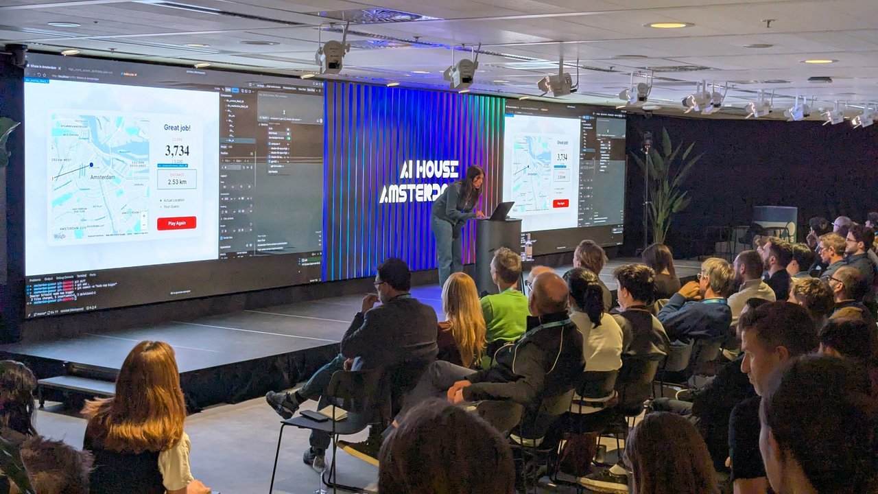 Cursor demo at AI House Amsterdam showing the Where in Amsterdam map game with a score of 3,734 next to the editor