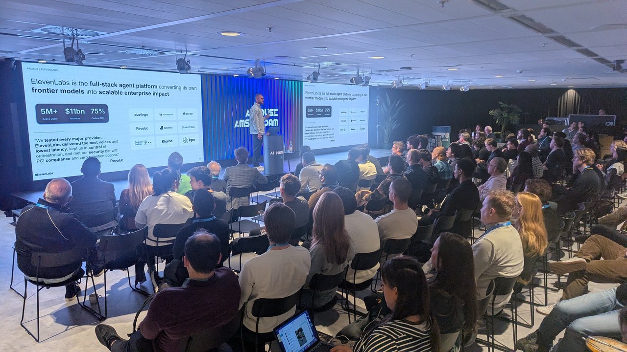 Max Lemmens presenting the ElevenLabs full-stack agent platform slide with 5M+ users and customer logos at AI House Amsterdam