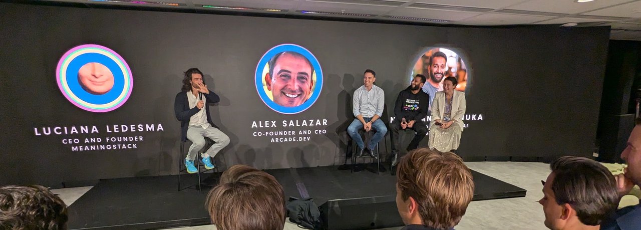 Agents in Production panel on the AI House stage, with name cards for Luciana Ledesma, CEO and founder of MeaningStack, and Alex Salazar, co-founder and CEO of Arcade.dev, on the screen behind the panellists