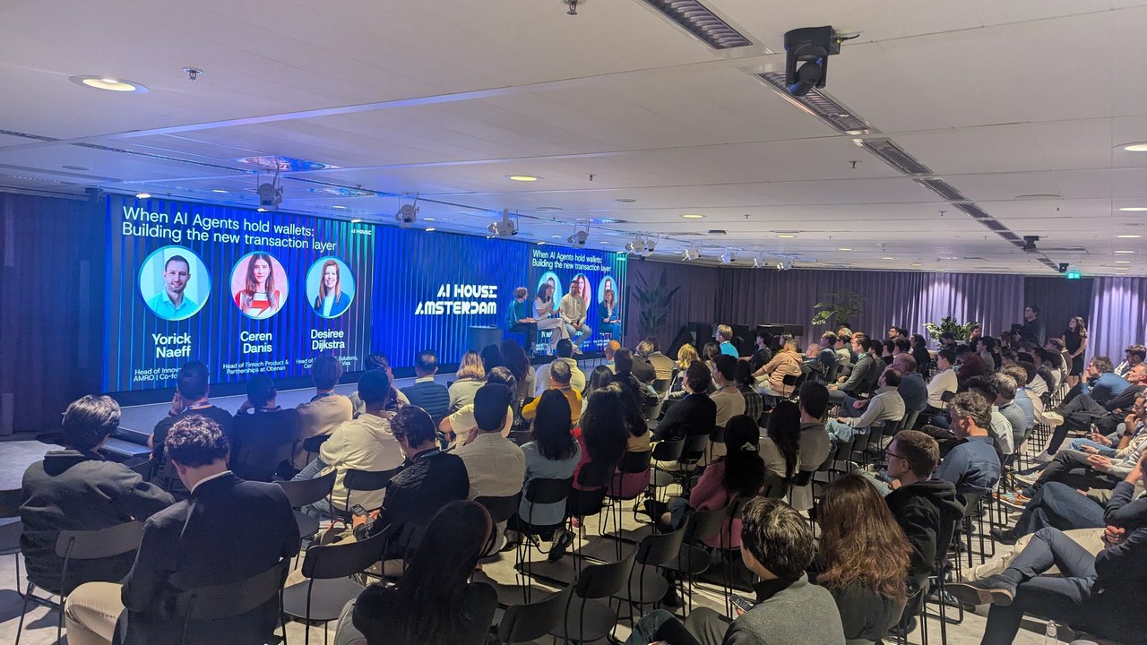 Full audience facing the When AI Agents hold wallets panel on stage at AI House Amsterdam