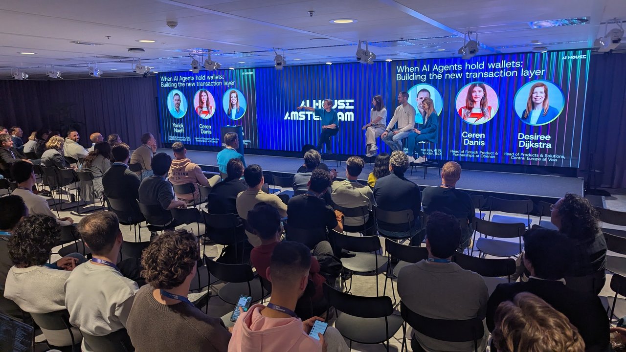 Wide view of the AI House Amsterdam stage and audience during the agentic payments panel