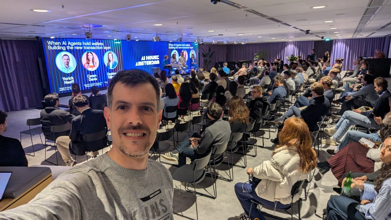 Luca Berton taking a selfie in the audience during the AI agents and wallets panel at AI House Amsterdam