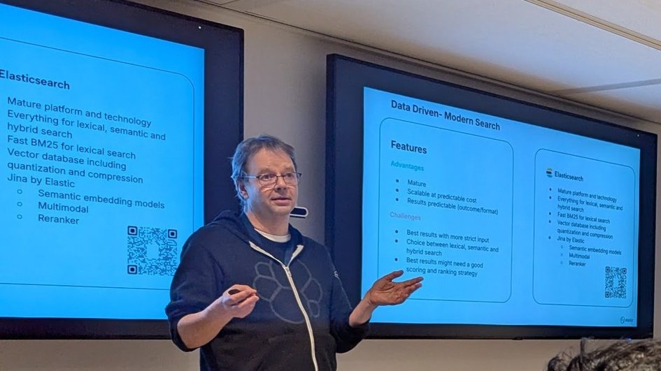 Hans Heerooms presenting the Data Driven Modern Search slide, listing advantages and challenges next to Elasticsearch features such as BM25, vector database and Jina by Elastic