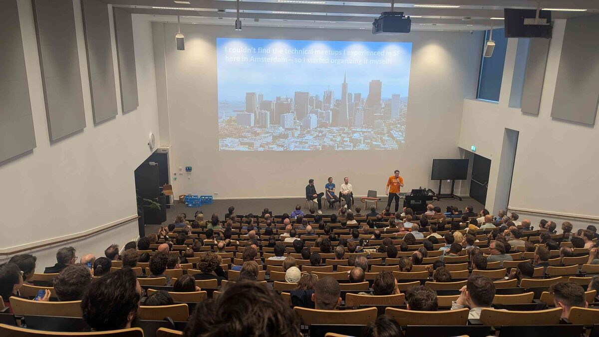 Origin story slide — SF skyline with quote about bringing SF-quality AI meetups to Amsterdam