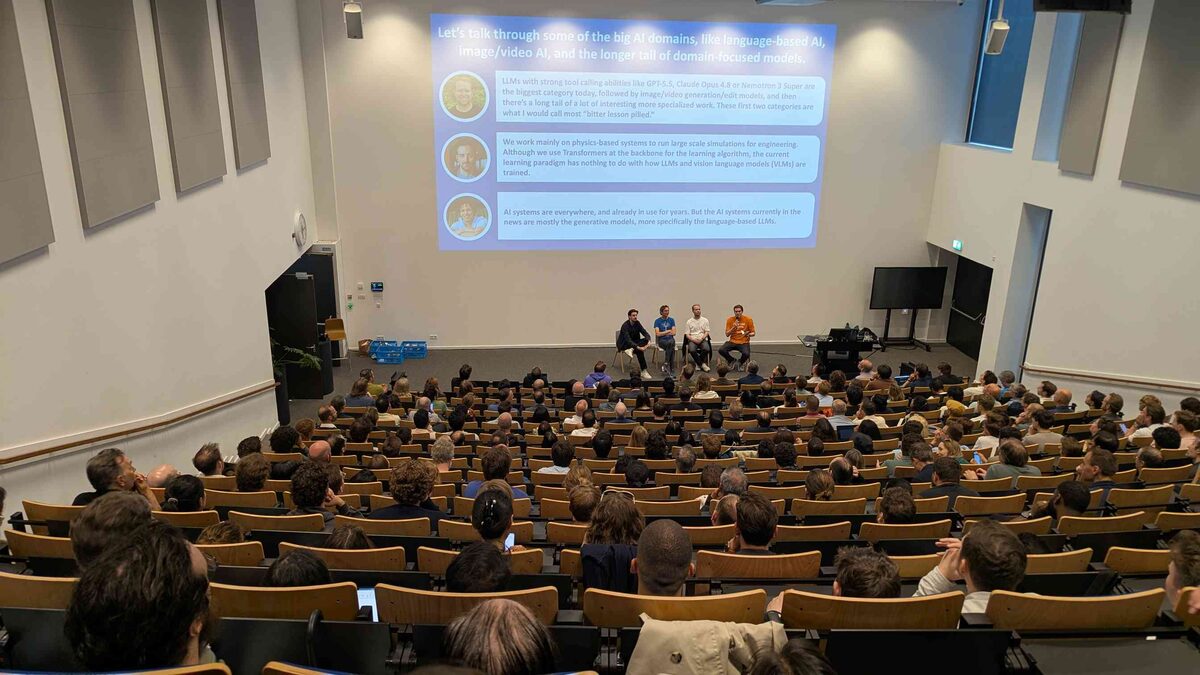 Wide angle of packed auditorium during the AI domains discussion