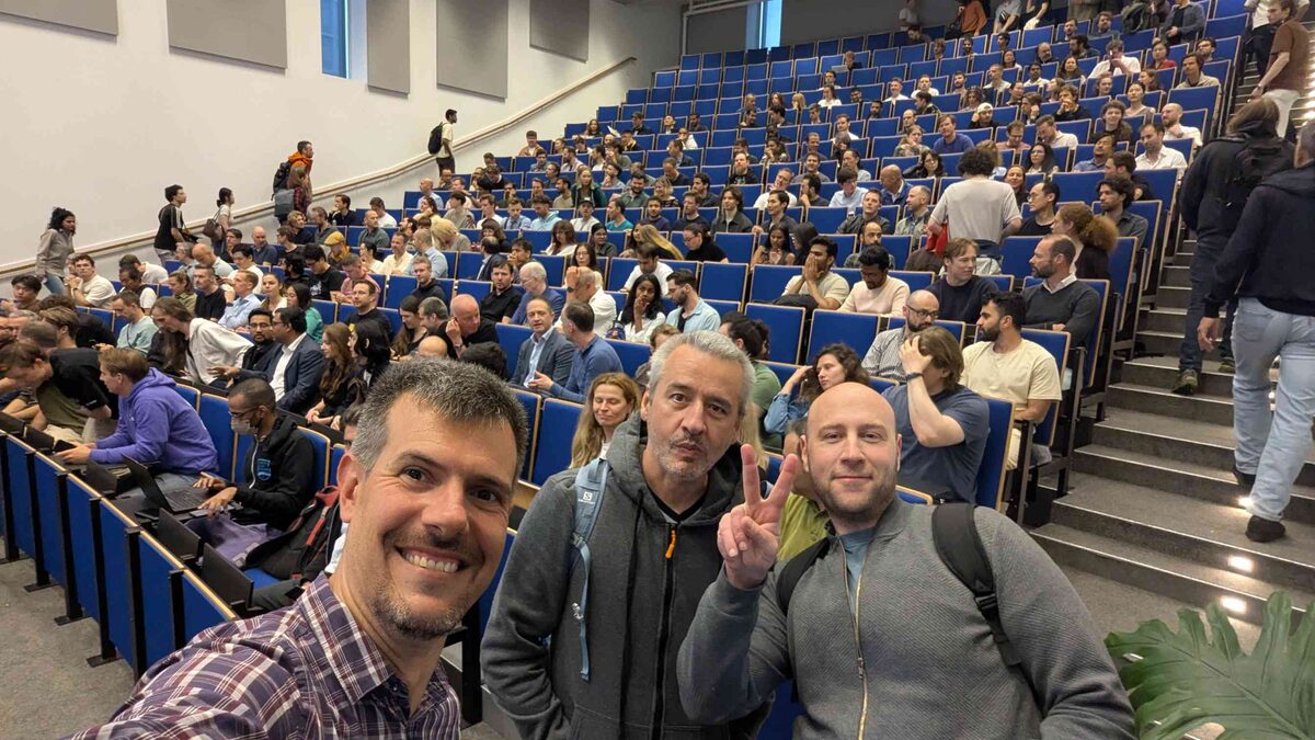 Selfie with fellow attendees — packed blue-seat auditorium at VU Amsterdam