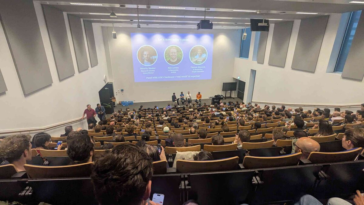 Panel introduction slide — Maurits Bleeker (Emmi/Mistral), Rick Lamers (NVIDIA), Thomas Mensink (Google DeepMind) — packed auditorium