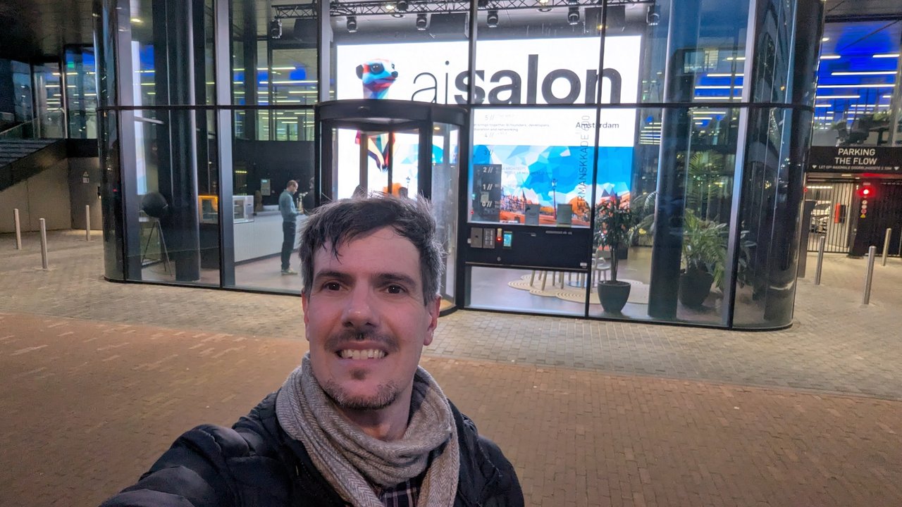 Luca Berton outside The Flow in Houthavens, Amsterdam, with the aisalon Amsterdam screen visible in the glass entrance