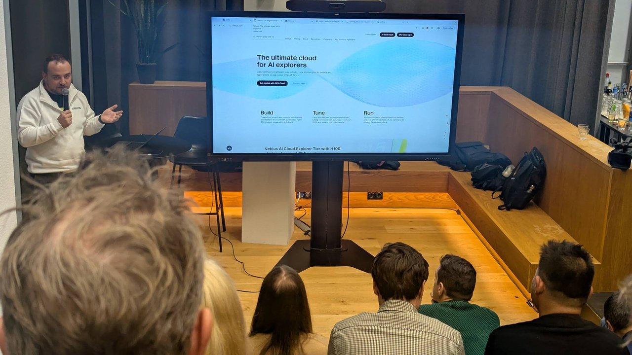 The Nebius presenter in front of the nebius.com homepage, The ultimate cloud for AI explorers, with Build, Tune and Run columns