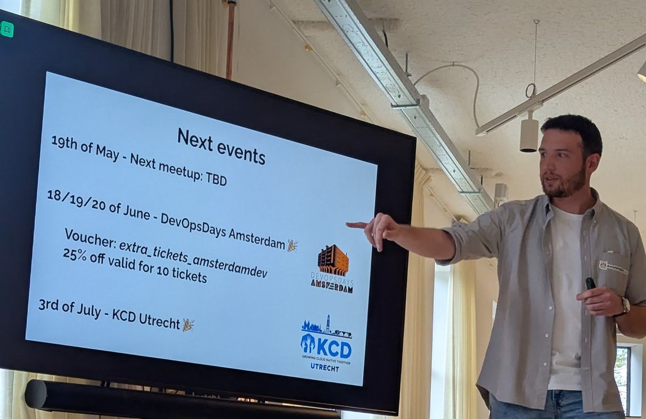 The Next events slide listing the 19 May meetup, DevOpsDays Amsterdam in June and KCD Utrecht in July, with the organiser pointing at it