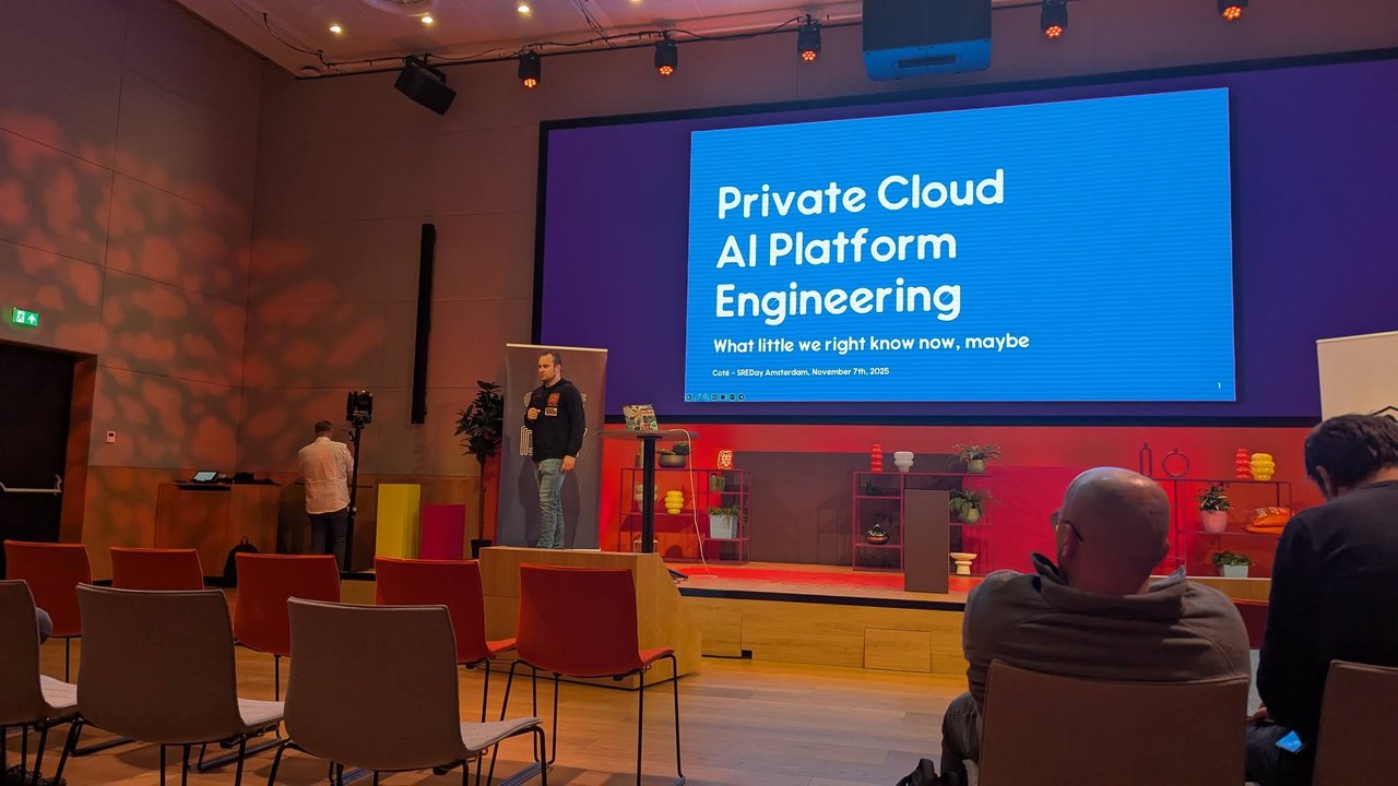 The SREday Amsterdam main stage with the title slide Private Cloud AI Platform Engineering: What little we right know now, maybe, Coté, SREDay Amsterdam, November 7th, 2025