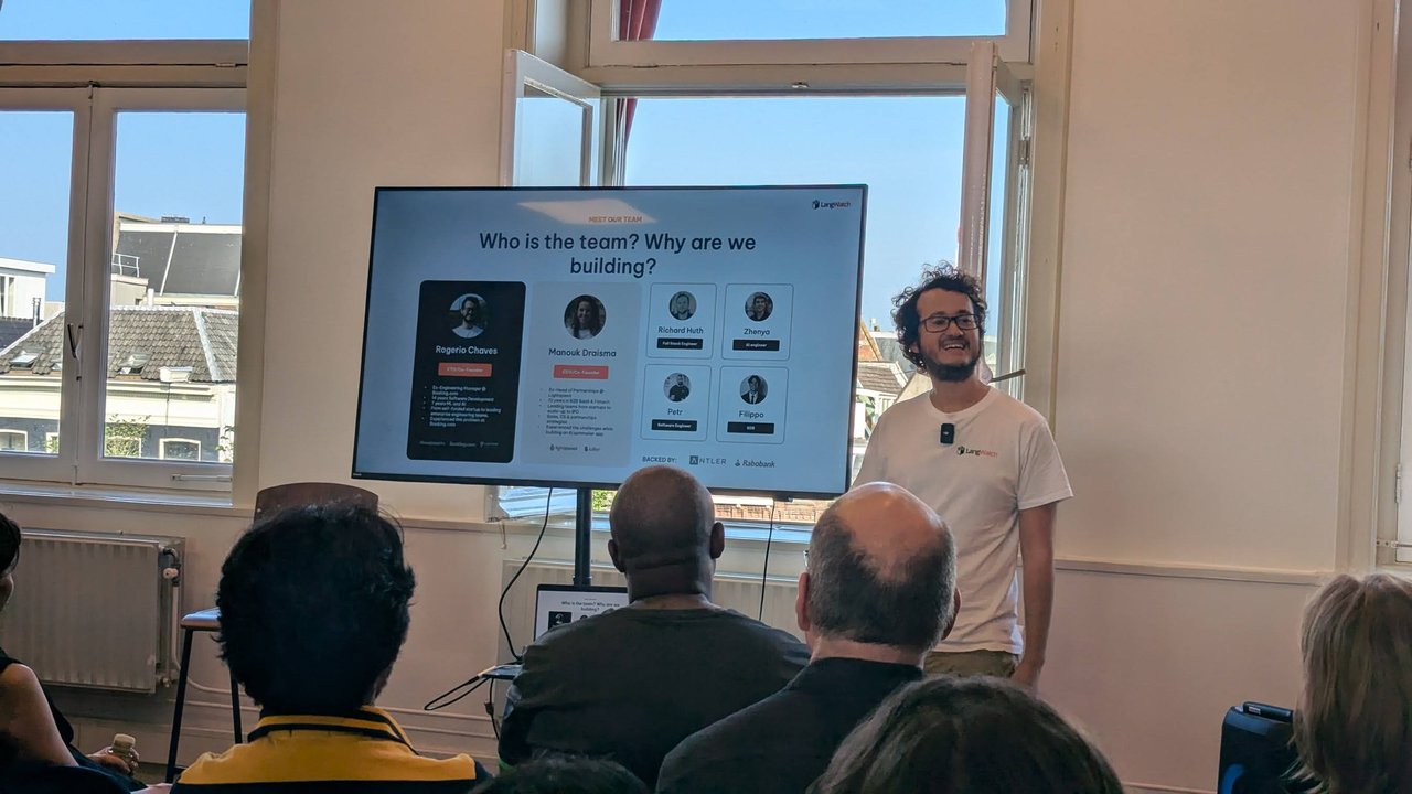 LangWatch presenter next to the "Who is the team? Why are we building?" slide showing the founders and team at the Mindstone AI Meetup