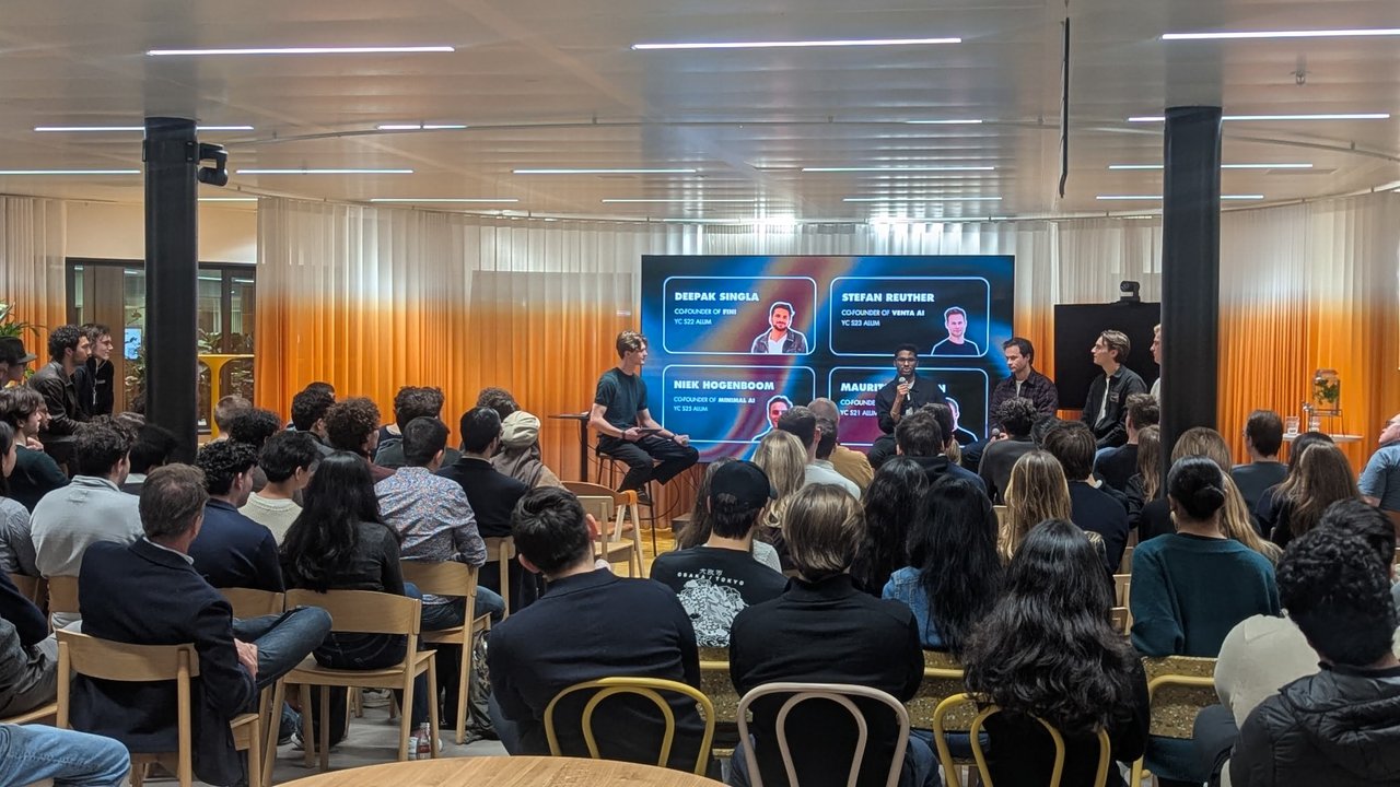 The Beyond the Batch founder panel at Miro Amsterdam, with a slide listing Deepak Singla, Stefan Reuther and Niek Hogenboom