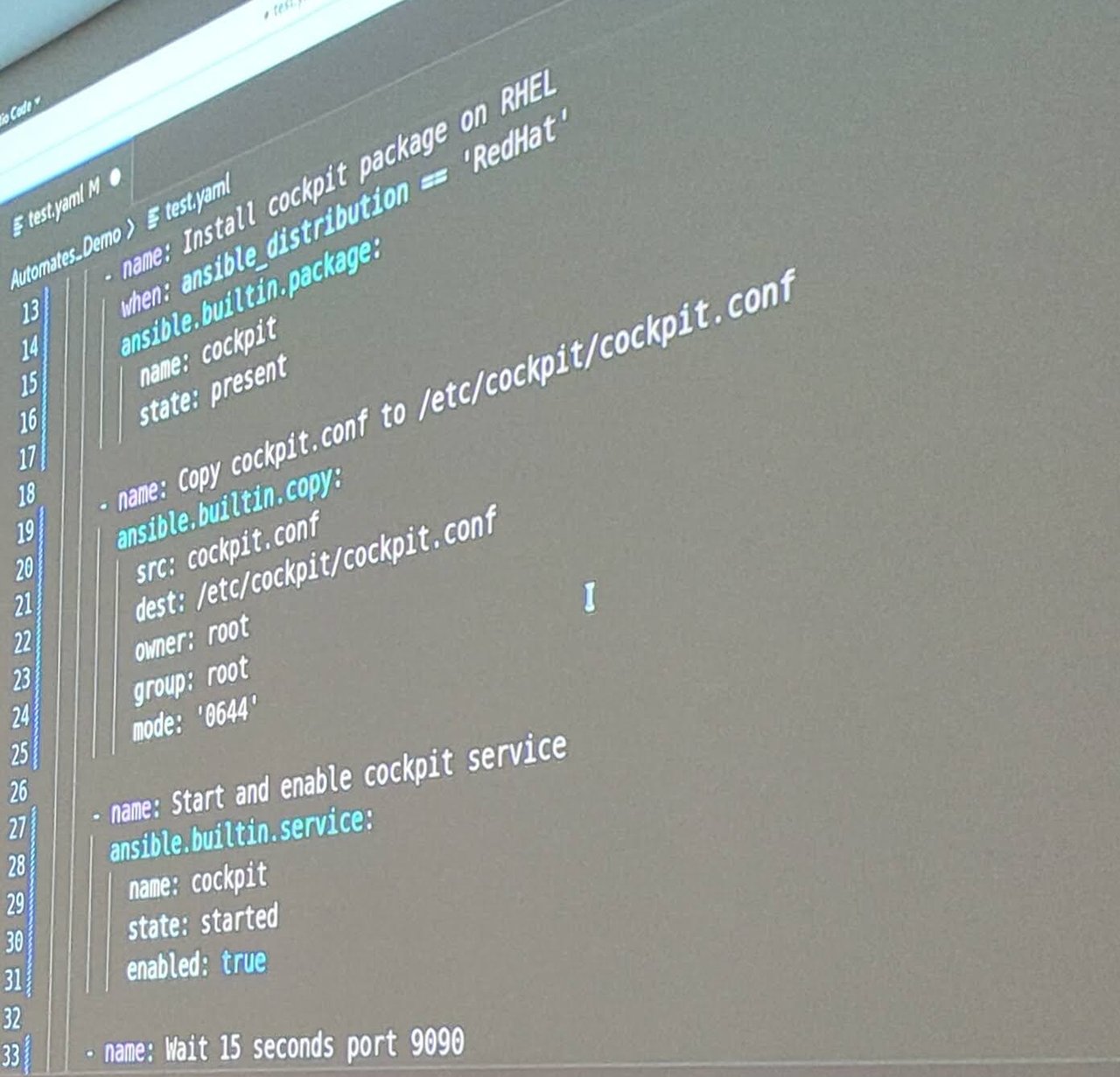 VS Code editor zoomed in on the demo playbook: install cockpit package on RHEL with a when condition, copy cockpit.conf with mode 0644, start and enable cockpit service, and wait 15 seconds for port 9090