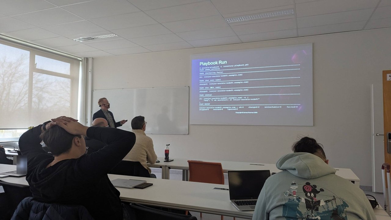 A CfgMgmtCamp 2025 slide titled Playbook Run showing ansible-playbook output against conjur-ansible-node01.example.com with Get user name and Get host name tasks