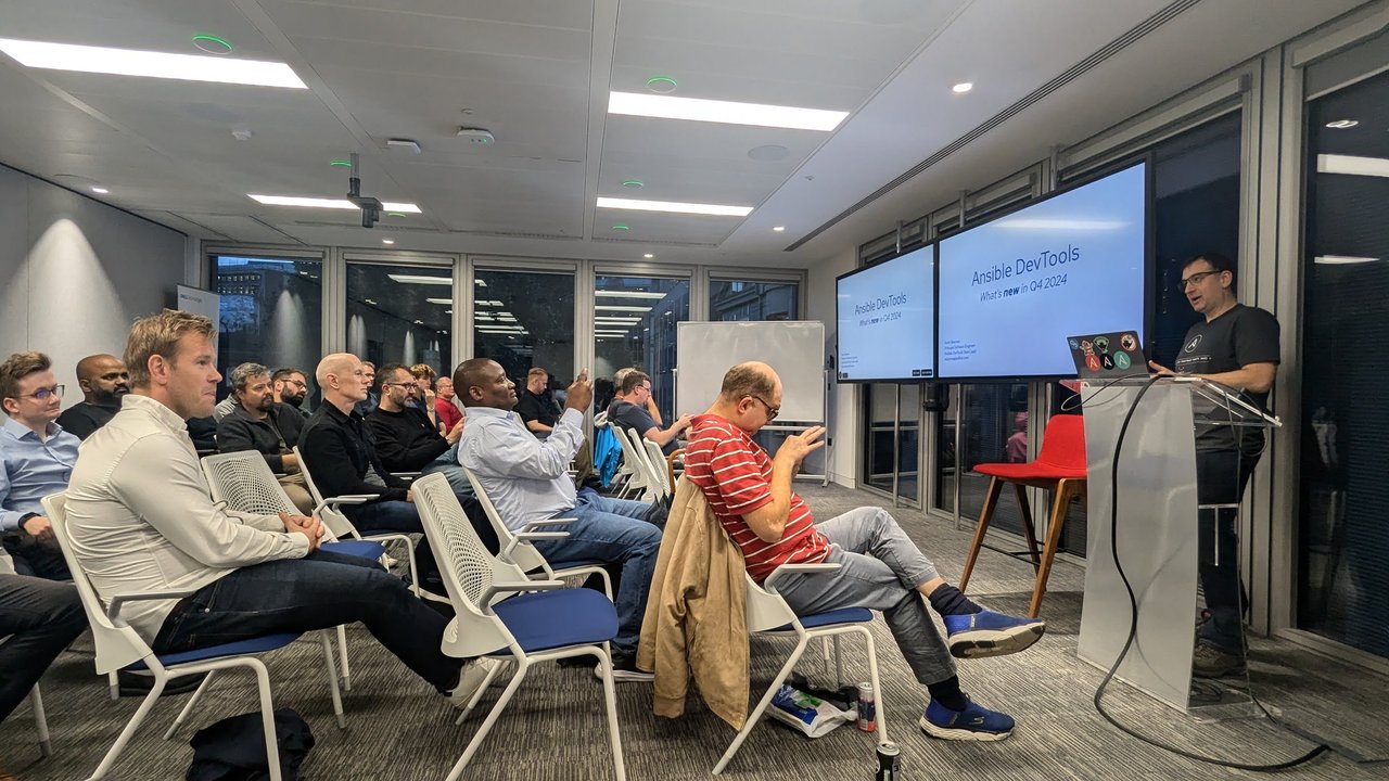 Sorin Sbarnea presenting the title slide 'Ansible DevTools: What's new in Q4 2024' at the Ansible London meetup