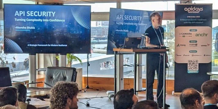 The API Security Turning Complexity into Confidence title slide on the screen, with the speaker at the lectern