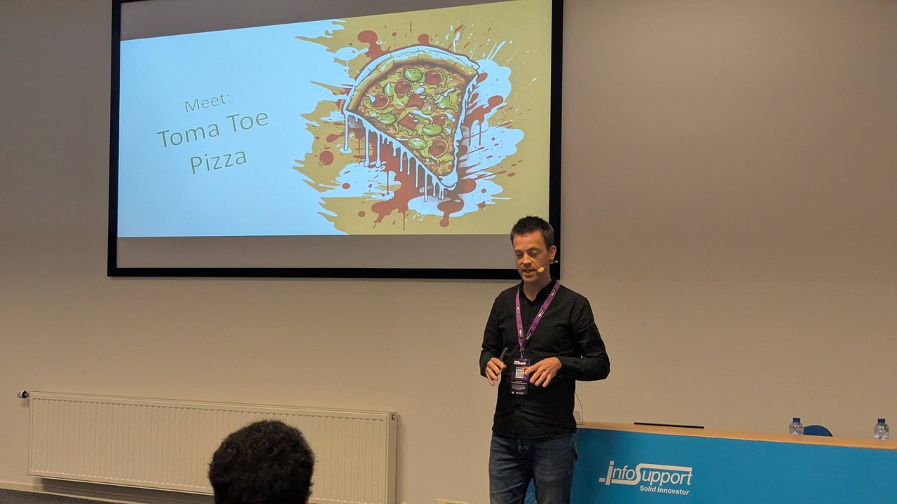 A slide from Erwin Staal's talk at BitBash 2025 reading Meet: Toma Toe Pizza, with a cartoon pizza slice