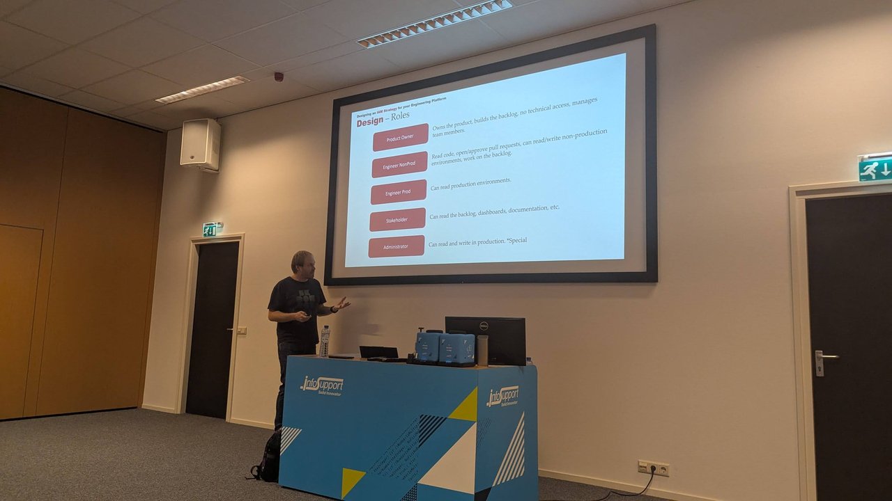 Design – Roles slide at BitBash 2025 listing Product Owner, Engineer NonProd, Engineer Prod, Stakeholder and Administrator with their permissions
