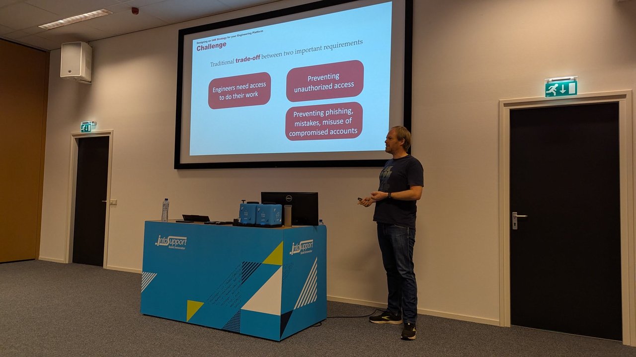 Henry Been presenting the Challenge slide at BitBash 2025: engineers need access versus preventing unauthorized access, phishing and misuse of compromised accounts