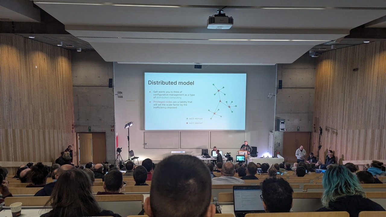 A Salt talk slide titled Distributed model, saying Salt wants you to think of configuration management as a type of distributed computing, with a diagram of salt-master and salt-minion nodes