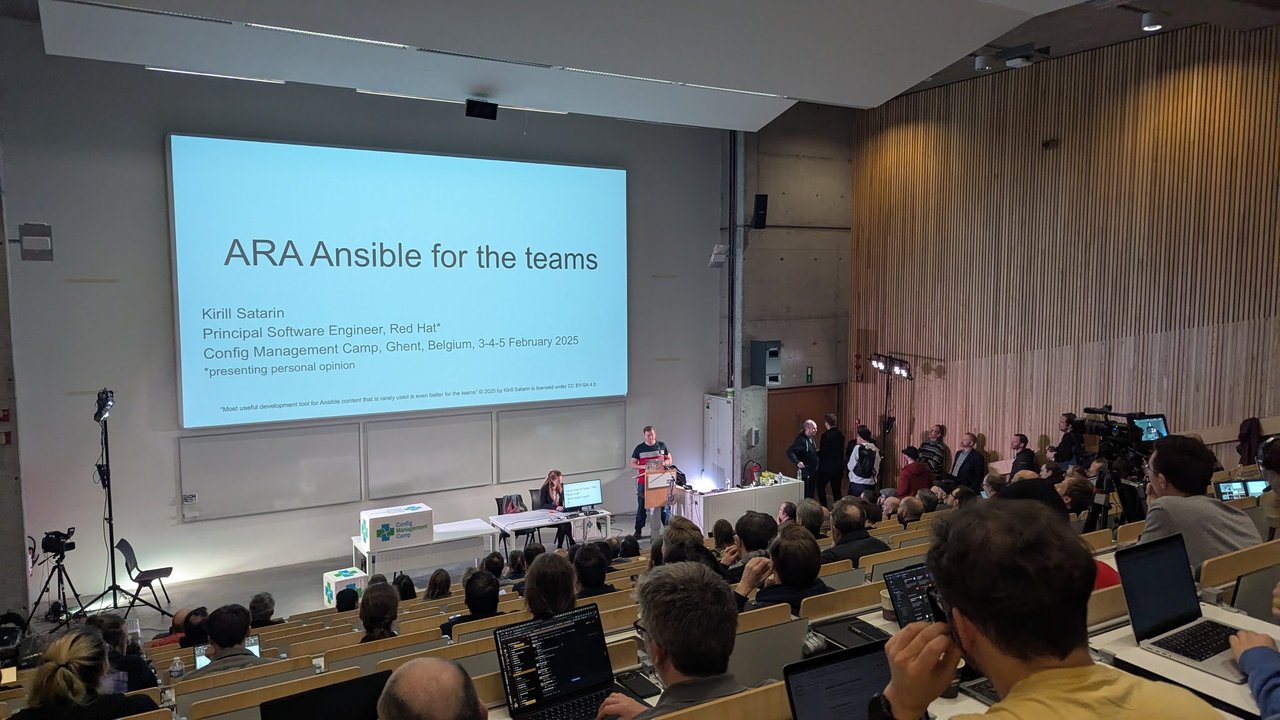 Kirill Satarin presenting ARA Ansible for the teams in the main auditorium at CfgMgmtCamp 2025 in Ghent