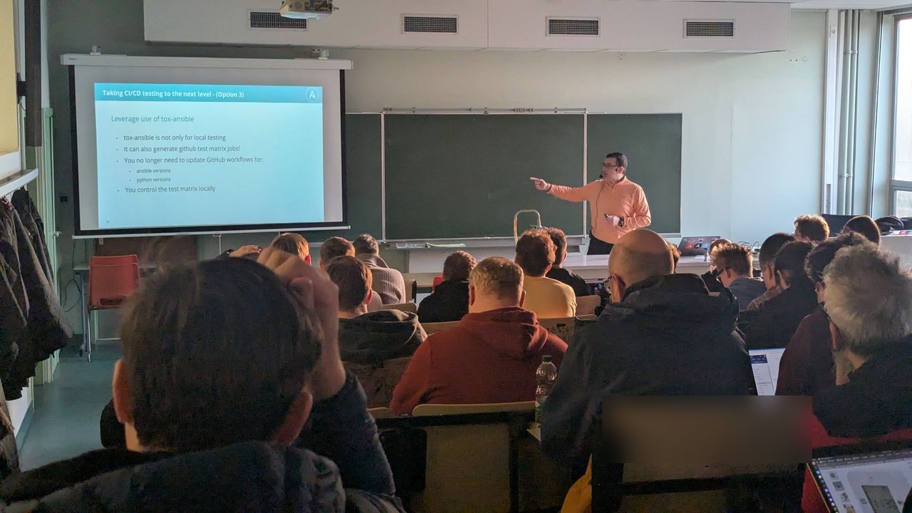 A speaker presenting tox-ansible as a way to generate GitHub test matrix jobs at CfgMgmtCamp 2025 in Ghent