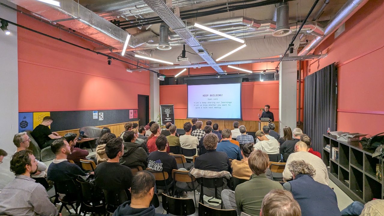 Keep Building open call slide at Claude Code Meetup Amsterdam inviting attendees to share learnings and give a talk at the next meetup
