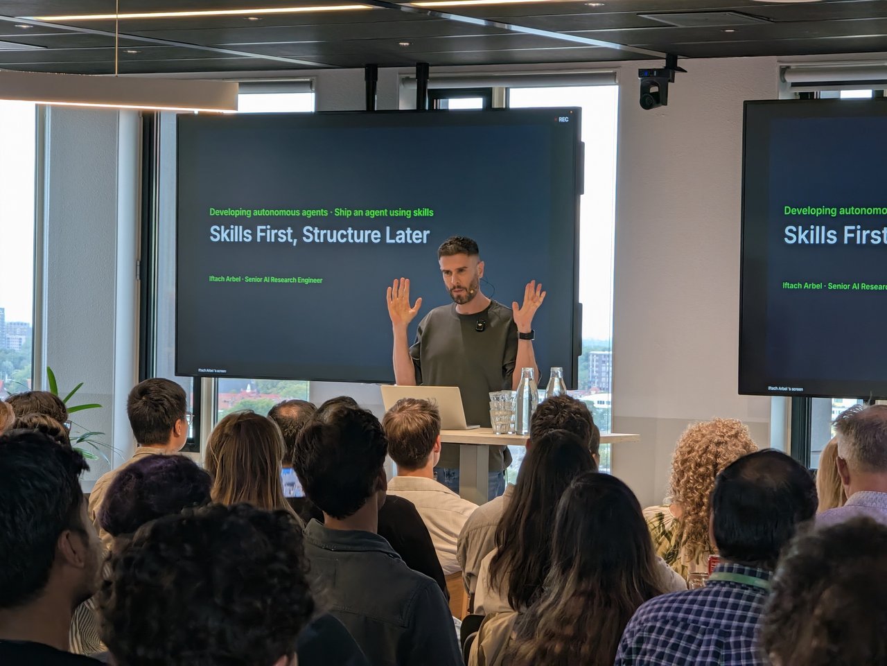 Iftach Arbel on stage at Adyen in front of his title slide, Skills First, Structure Later: Developing autonomous agents, ship an agent using skills