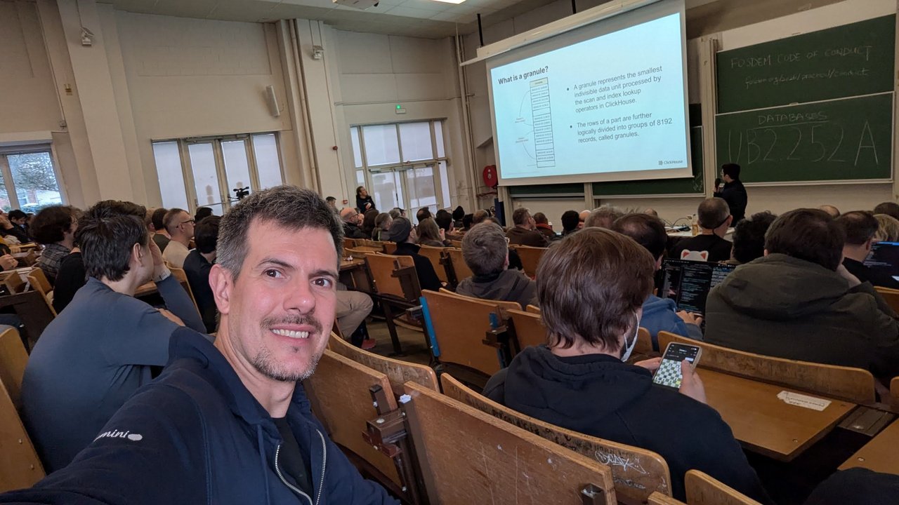 The What is a granule slide in room UB2.252A at FOSDEM 2026: a granule is the smallest indivisible data unit processed by the scan and index lookup operators, and the rows of a part are divided into groups of 8192 records