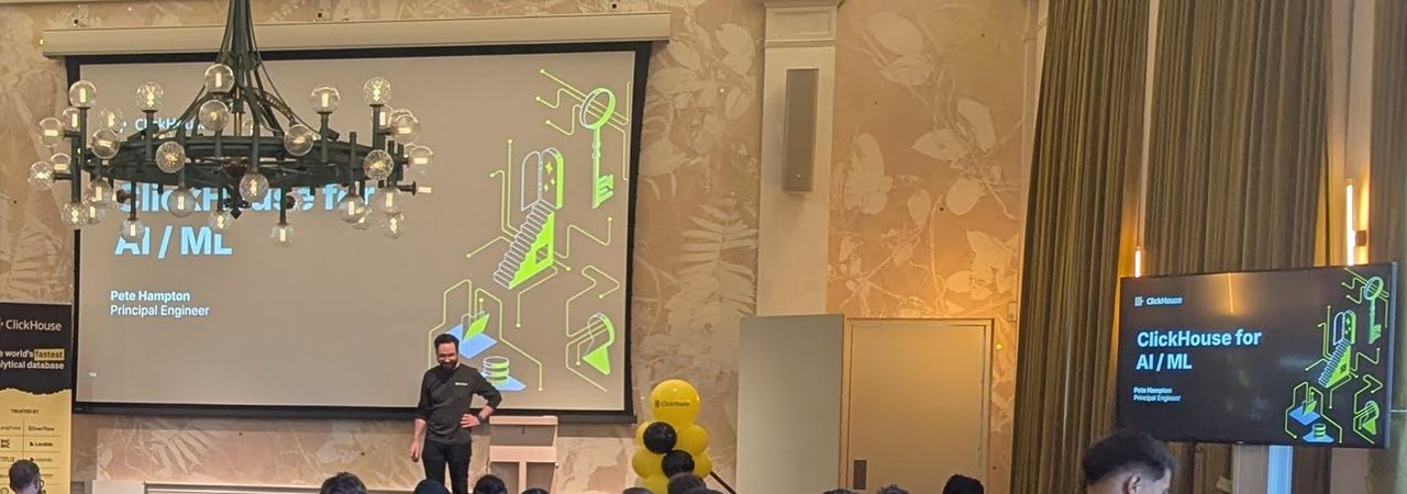 ClickHouse for AI / ML title slide by Pete Hampton, Principal Engineer, on the main screen and the side screen, with the speaker on stage
