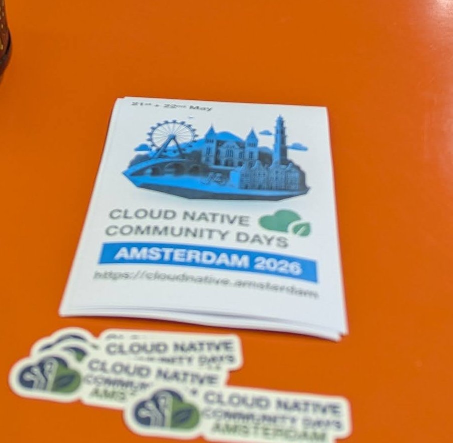 Flyer and stickers for Cloud Native Community Days Amsterdam 2026, 21st and 22nd May, with the address cloudnative.amsterdam