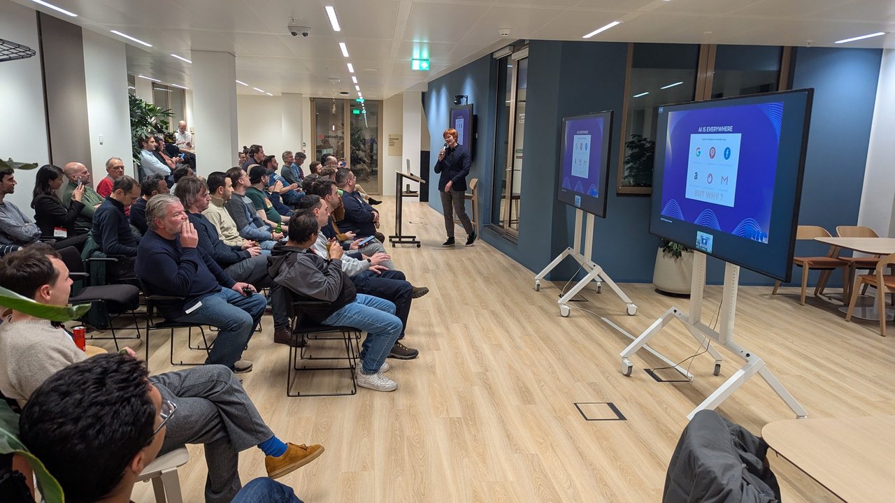 The second speaker presenting the AI is everywhere slide to a full room at the Palo Alto Networks office