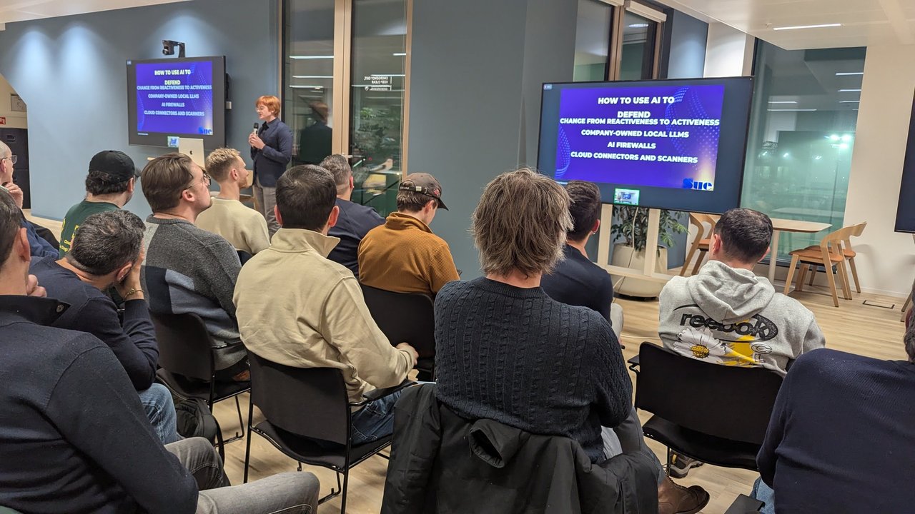 Slide titled How to use AI to defend, listing change from reactiveness to activeness, company-owned local LLMs, AI firewalls and cloud connectors and scanners