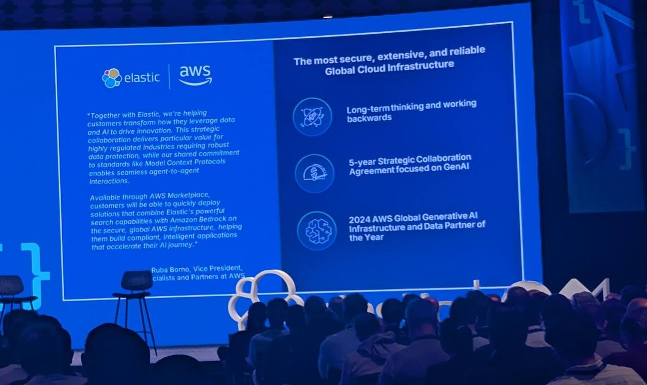 Michael Rambold on the ElasticON main stage in front of the Elastic and AWS partnership slide