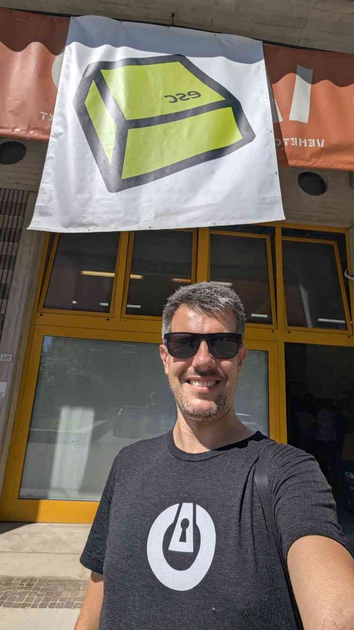 Luca Berton at End Summer Camp 2026 — selfie with the ESC escape-key banners