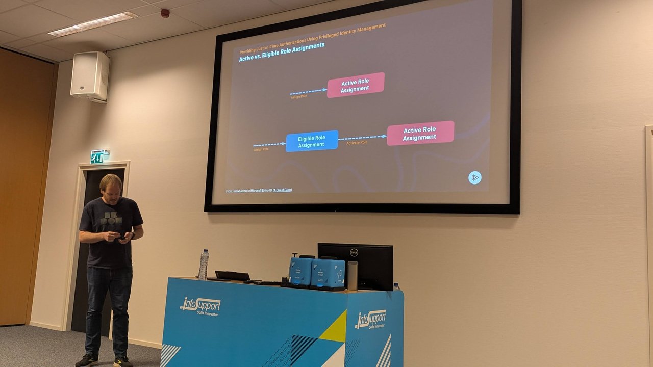 Active vs. Eligible Role Assignments slide at BitBash 2025: assigning a role directly creates an active assignment, while an eligible assignment must be activated to become active