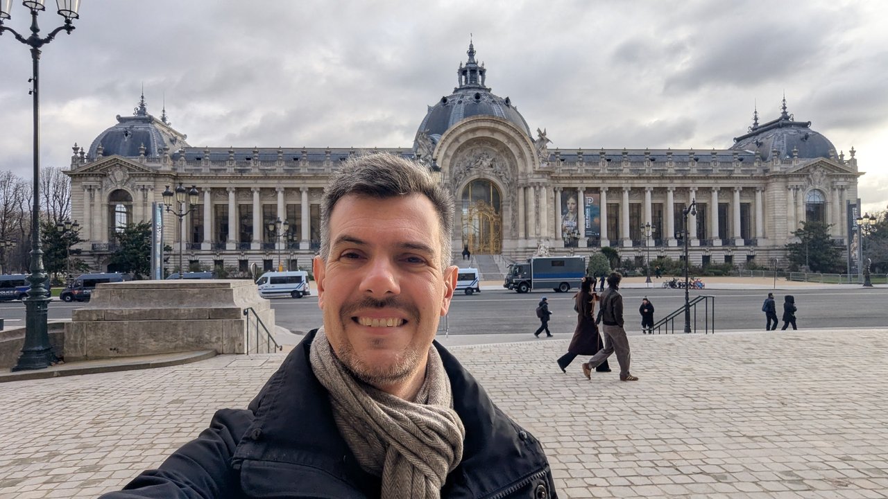 Luca Berton taking a selfie in front of the Petit Palais in Paris under a grey January sky