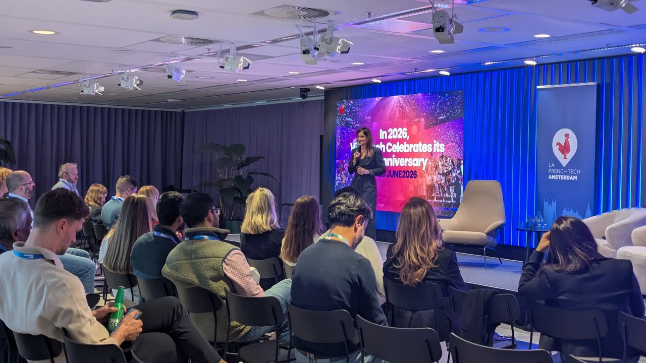 A presenter on stage in front of a slide announcing that VivaTech celebrates its 10th anniversary in June 2026, with the audience in the foreground