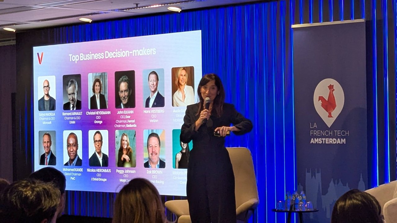 A VivaTech presenter in front of a Top Business Decision-makers slide showing portraits of executives including Satya Nadella, Bernard Arnault and Christel Heydemann