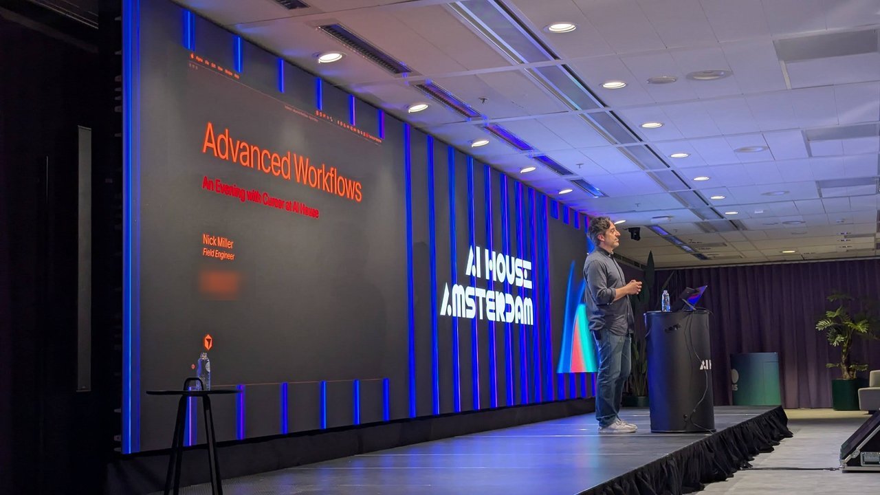 Nick Miller presenting next to the Advanced Workflows title slide and the AI House Amsterdam logo
