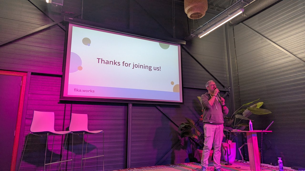 The FikaWorks Day closing slide reading Thanks for joining us, with the fika.works logo, on the pink-lit stage