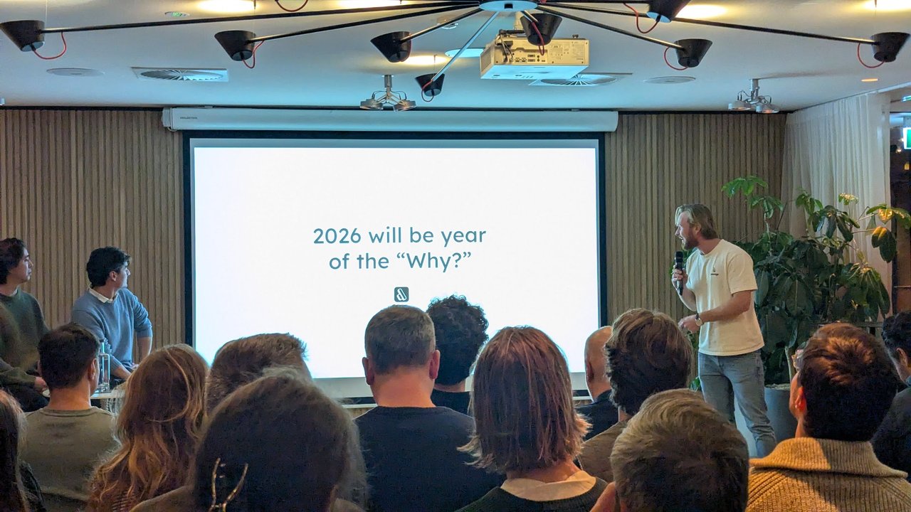 Lleverage slide reading 2026 will be year of the Why with the other speakers seated beside the stage