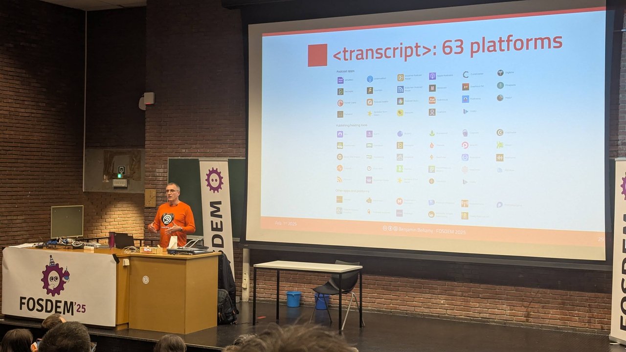 Benjamin Bellamy presenting a slide titled transcript: 63 platforms, listing podcast apps and hosting tools that support the tag, at FOSDEM 2025