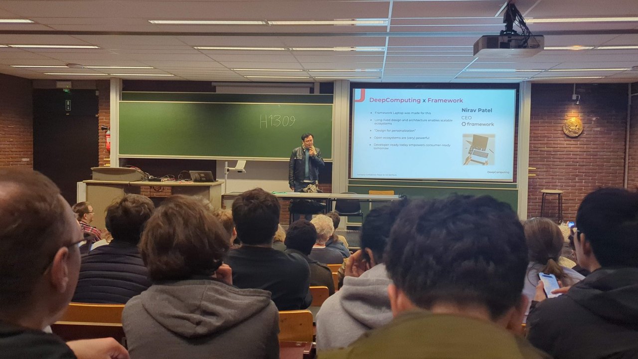 DeepComputing x Framework slide with a quote from Nirav Patel, CEO of Framework, in room H.1309 at FOSDEM 2025