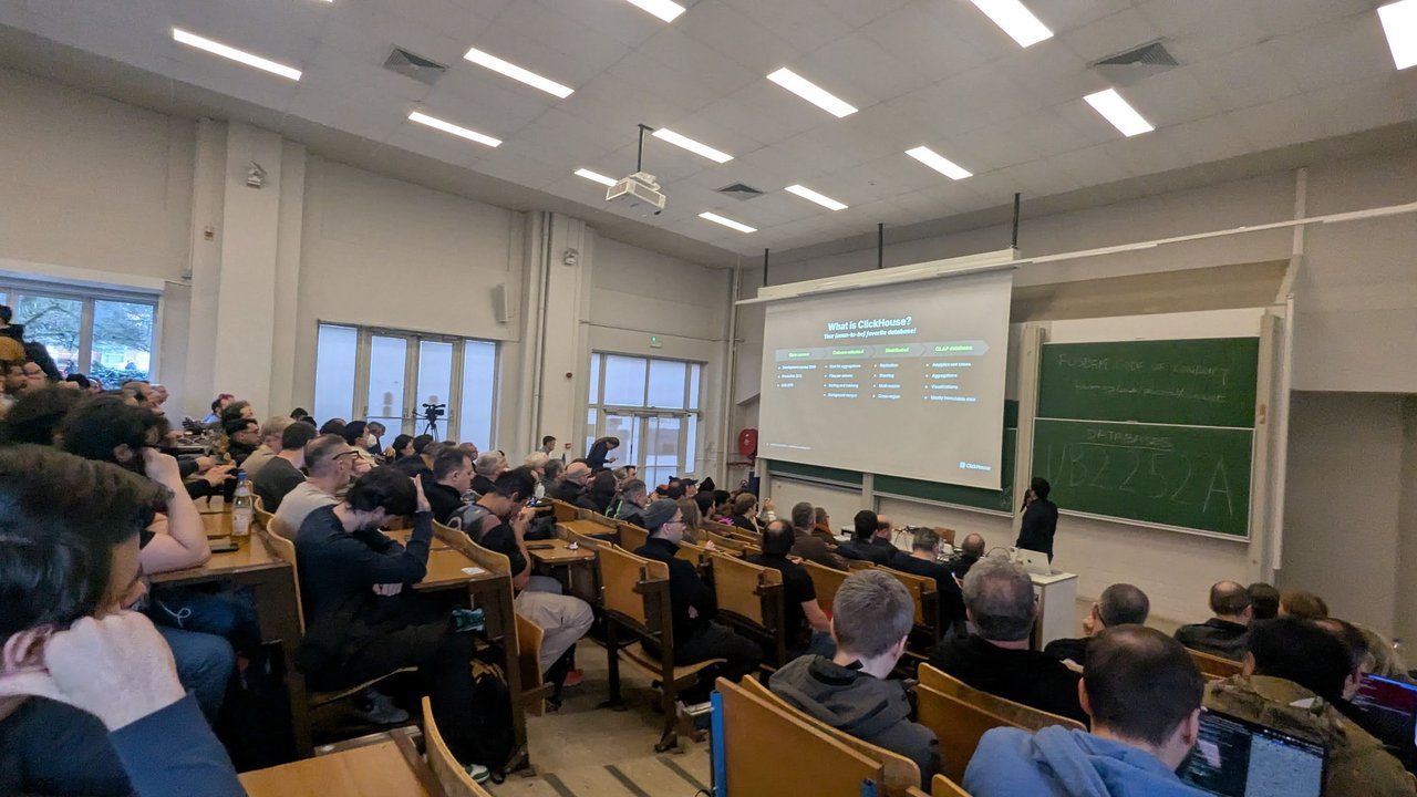 What is ClickHouse slide in the Databases devroom in room UB2.252A at FOSDEM 2026, seen from the back of a full amphitheatre