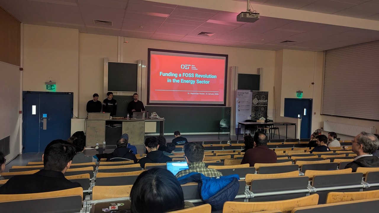 Funding a FOSS Revolution in the Energy Sector title slide in room UD2.218 at FOSDEM 2026, with Sovereign Tech Agency and NLnet banners