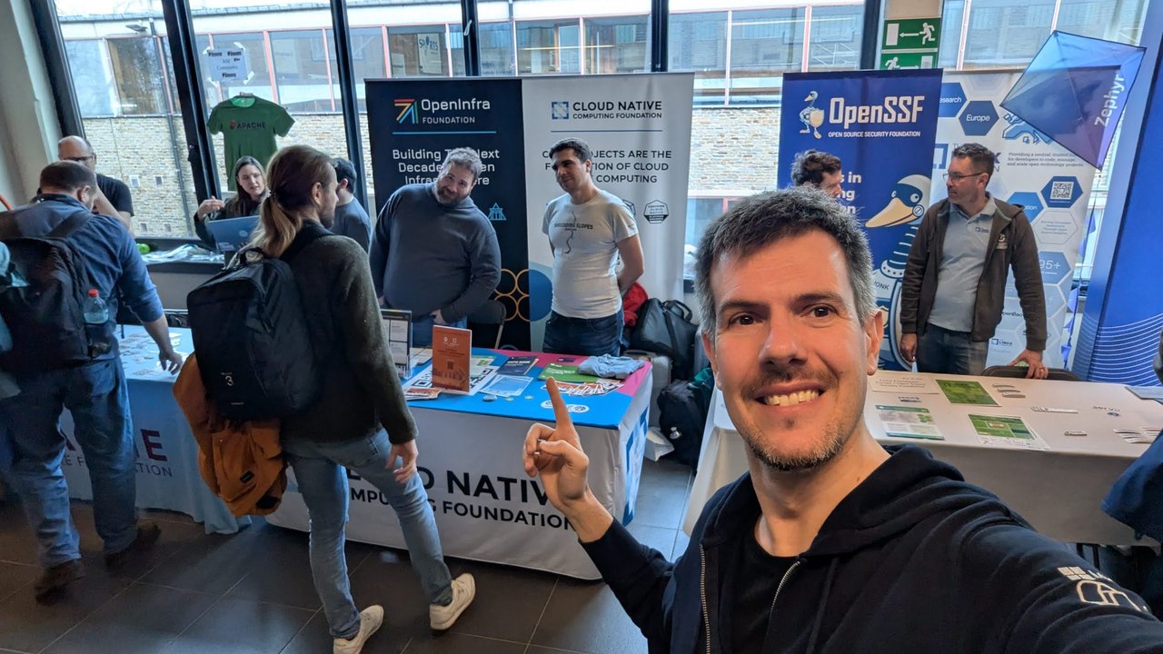 Luca Berton at the OpenInfra Foundation, Cloud Native Computing Foundation and OpenSSF stands at FOSDEM 2026